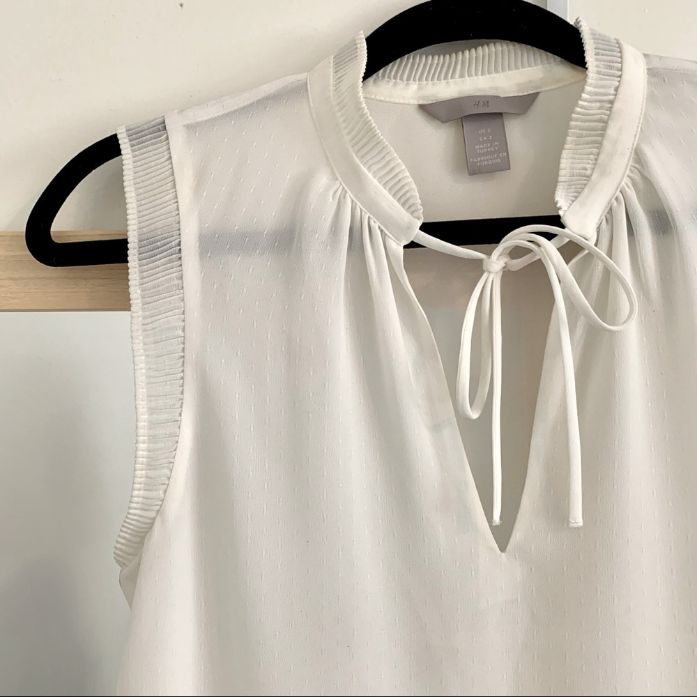 white, tank top blouse.